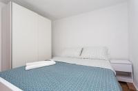 Postel nebo postele na pokoji v ubytování Apartmani Obala