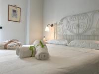 Posteľ alebo postele v izbe v ubytovaní Casa vacanze Borgo marinaro