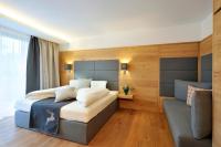 Łóżko lub łóżka w pokoju w obiekcie Sunnsait - Appartements für Genießer