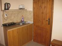 Kuchyň nebo kuchyňský kout v ubytování Apartmány U Vlka