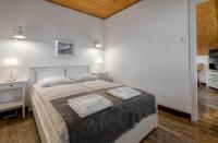 Posteľ alebo postele v izbe v ubytovaní Apartamenty Zdrojowa