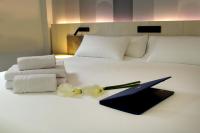 Hotel NERU con Encantoにあるベッド