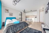 Posteľ alebo postele v izbe v ubytovaní Apartamenty Sun & Snow Rezydencja Park