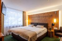Ein Bett oder Betten in einem Zimmer der Unterkunft Hotel Jägerhof