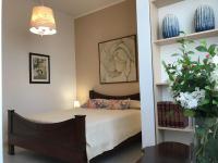 A bed or beds in a room at Alghero Roof Garden