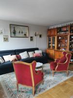 a living room with a couch and two chairs at Suite Clémenceau 82 in Reims