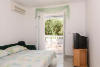 Postel nebo postele na pokoji v ubytování Apartments Golubić