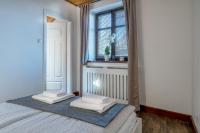 Posteľ alebo postele v izbe v ubytovaní Apartamenty Zdrojowa