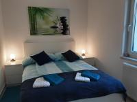 Postel nebo postele na pokoji v ubytování Apartments Barbi