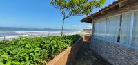 a house with a view of the beach at Hotel Nils in Itapoa