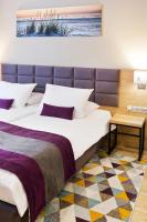 Łóżko lub łóżka w pokoju w obiekcie Hotel CONRAD Comfort
