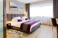 Łóżko lub łóżka w pokoju w obiekcie Hotel CONRAD Comfort