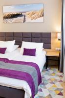 Łóżko lub łóżka w pokoju w obiekcie Hotel CONRAD Comfort