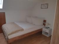 A bed or beds in a room at Ferienwohnung Gmeiner