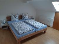 A bed or beds in a room at Ferienwohnung Gmeiner