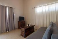 Televízia a/alebo spoločenská miestnosť v ubytovaní Villa Elaia Suites & Apartments No.7