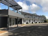 a large white building with a lot of windows at Clouds Montville in Montville