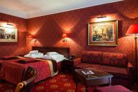 a hotel room with a bed and a couch at Hotel Branicki in Białystok
