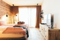 Postel nebo postele na pokoji v ubytování Boutique Hotel Das Rivus