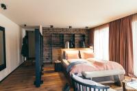 Postel nebo postele na pokoji v ubytování Boutique Hotel Das Rivus