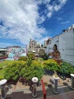 a view of a city with a statue of a woman at Art&#39;otel Ximending Taipei in Taipei