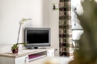Televízia a/alebo spoločenská miestnosť v ubytovaní COOL APARTMAN
