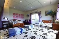 a large room with three beds in a room with at Winter&#39;s Love in Wujie