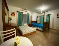 Postel nebo postele na pokoji v ubytování El Malecon B&B Hotel