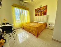 Postel nebo postele na pokoji v ubytování El Malecon B&B Hotel