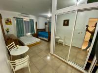 Postel nebo postele na pokoji v ubytování El Malecon B&B Hotel