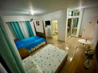 Postel nebo postele na pokoji v ubytování El Malecon B&B Hotel
