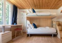 Postel nebo postele na pokoji v ubytování Chalet Hunnenfluh