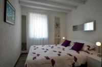 Łóżko lub łóżka w pokoju w obiekcie Apartment ALESSIA