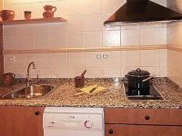 A kitchen or kitchenette at Apartamentos Turismo Rural Casa Santorroman