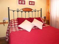 A bed or beds in a room at Apartamentos Turismo Rural Casa Santorroman