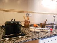 A kitchen or kitchenette at Apartamentos Turismo Rural Casa Santorroman