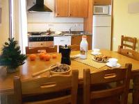 A kitchen or kitchenette at Apartamentos Turismo Rural Casa Santorroman