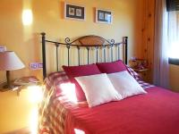 A bed or beds in a room at Apartamentos Turismo Rural Casa Santorroman