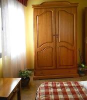 A bed or beds in a room at Apartamentos Turismo Rural Casa Santorroman