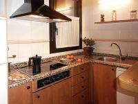 A kitchen or kitchenette at Apartamentos Turismo Rural Casa Santorroman