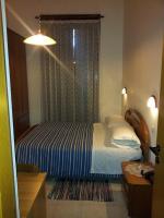 Łóżko lub łóżka w pokoju w obiekcie Hotel Acapulco