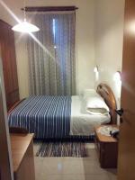 Łóżko lub łóżka w pokoju w obiekcie Hotel Acapulco