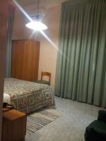 Łóżko lub łóżka w pokoju w obiekcie Hotel Acapulco
