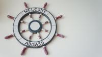 a wall clock with the welcome aboard sign at HL Sea Homestay in Hualien City