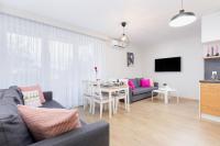 Televízia a/alebo spoločenská miestnosť v ubytovaní Apartament Bursztyn II Klifowa