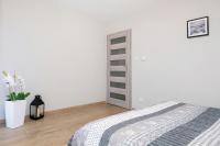 Posteľ alebo postele v izbe v ubytovaní Apartament Bursztyn II Klifowa