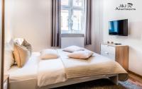 Posteľ alebo postele v izbe v ubytovaní J&J Apartments, Szeroka 25 Apartament 7