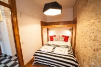 Postel nebo postele na pokoji v ubytování FLH Lisbon Sun Terrace Graça II
