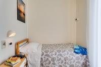 A bed or beds in a room at Hotel San Giorgio