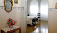A bed or beds in a room at Hostal Delfina